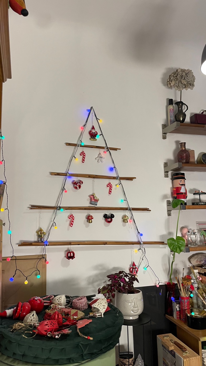 The same reed tree dressed with lights and small ornaments